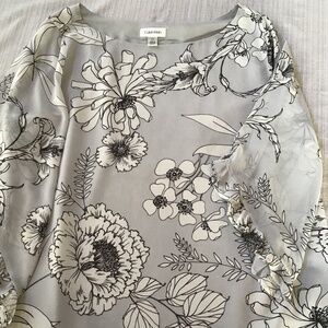 Woman’s Calvin Klein top with 3/4 ruffled sleeves.